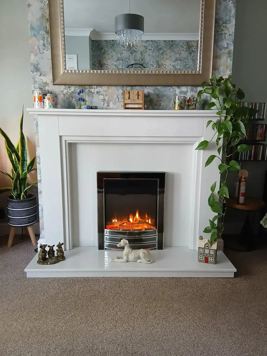 A Kelham marble fireplace in Blanco Micro with a Flavel Autograph slimline electric fire in a Kings Heath living room