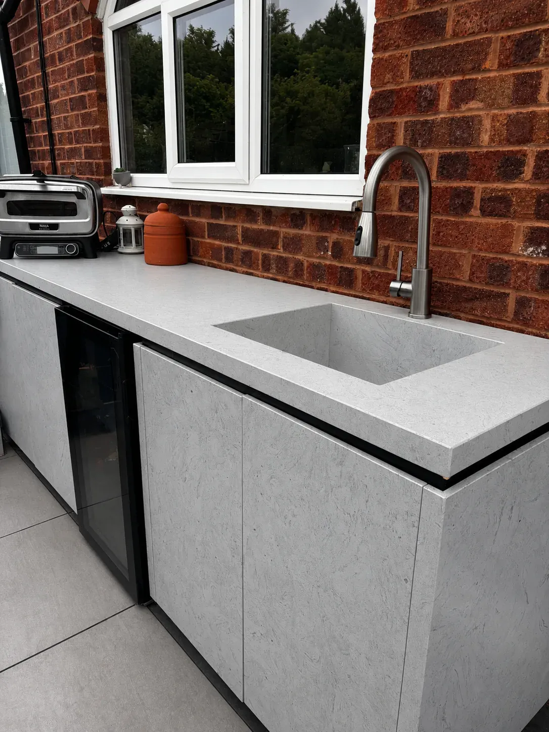 An outdoor kitchen and bespoke fire pit table in Birmingham, image 2