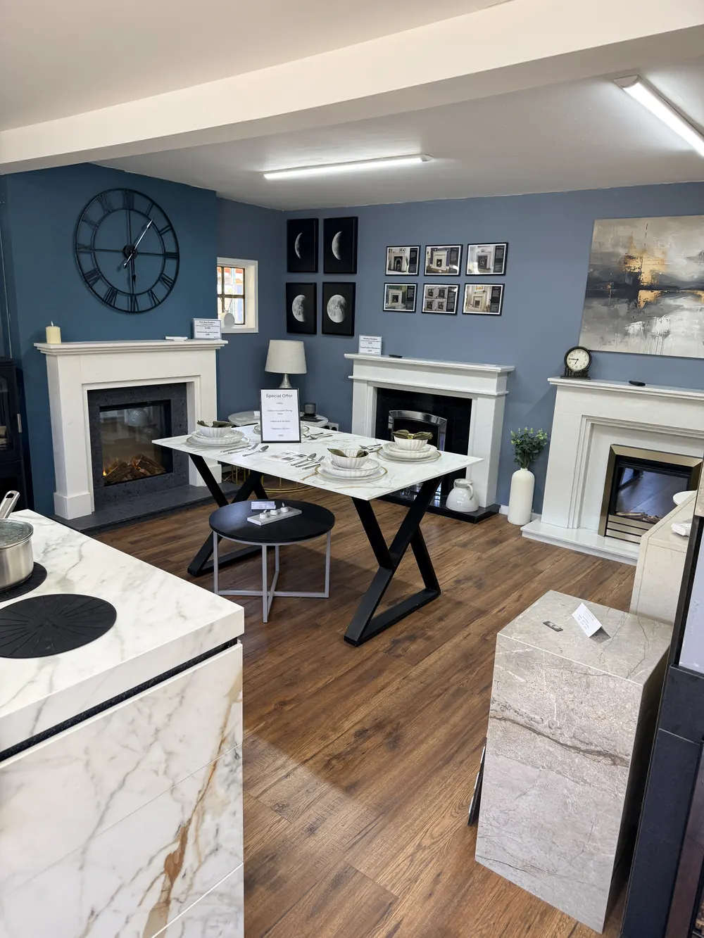 Inside the Sontuoso Stone showroom at Earlswood near Solihull, with several marble fireplace displays