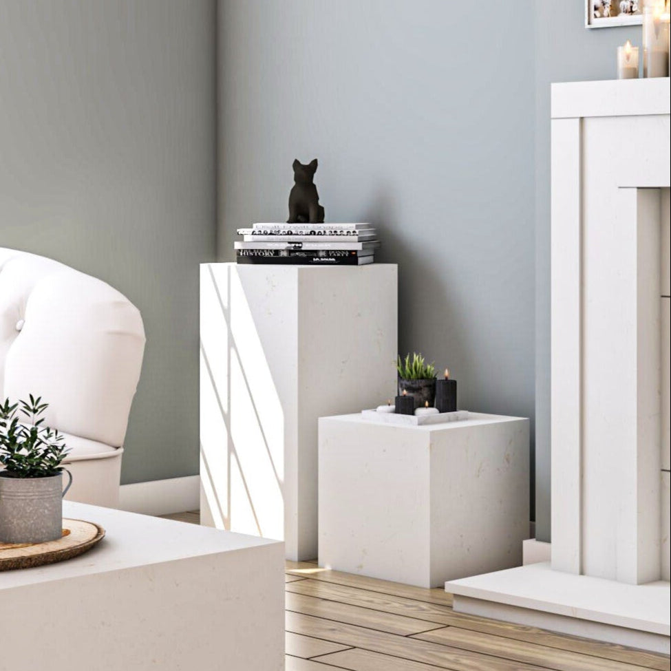 Outdoor stone pedestal and cube accent tables